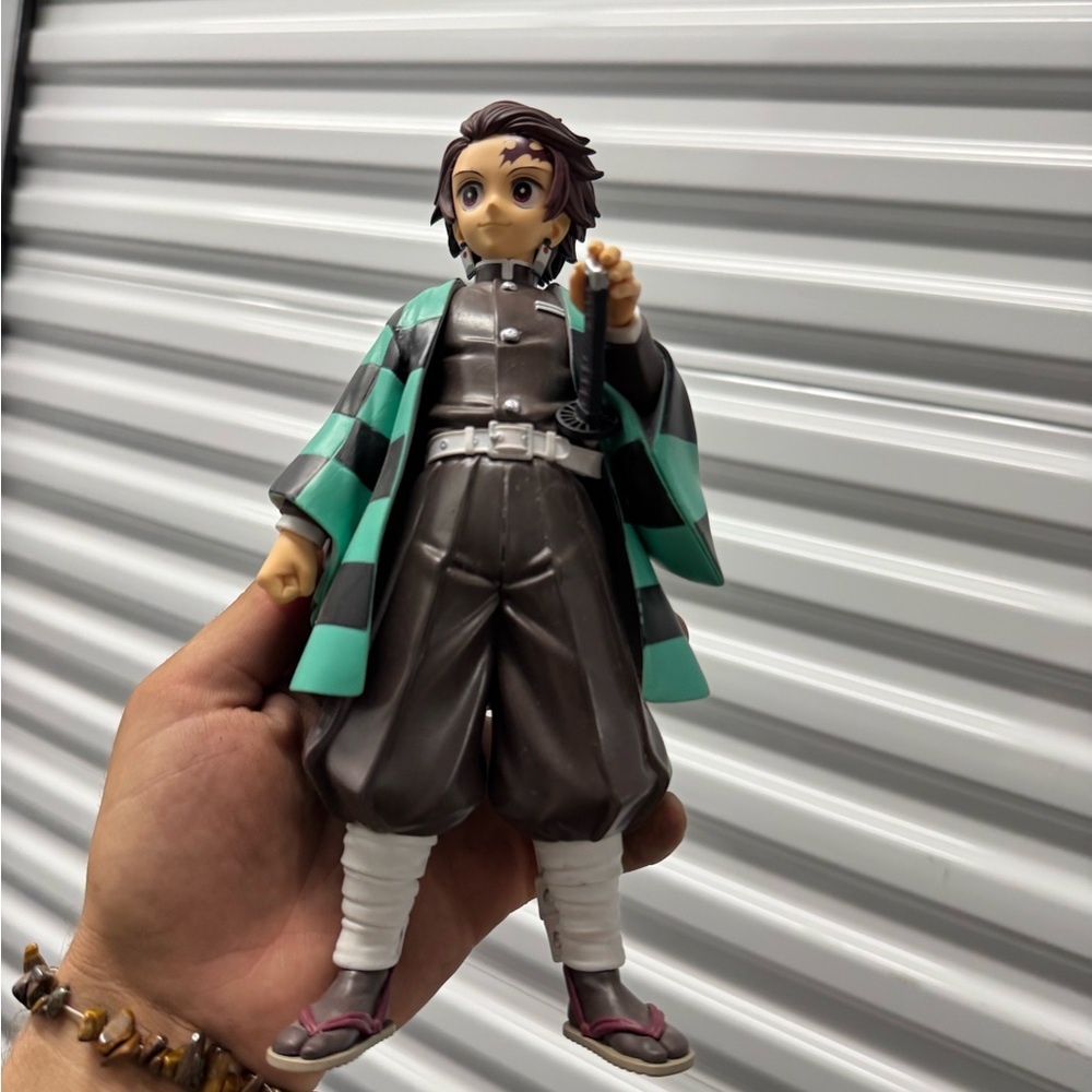 Anime Character Action Figure with Green and Brown Outfit